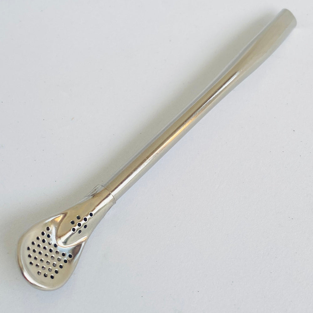 Silver tea infuser on a white background