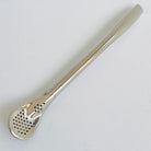 Silver tea infuser on a white background